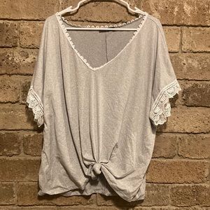Cute summer top with lace sleeves and detailed v-neck